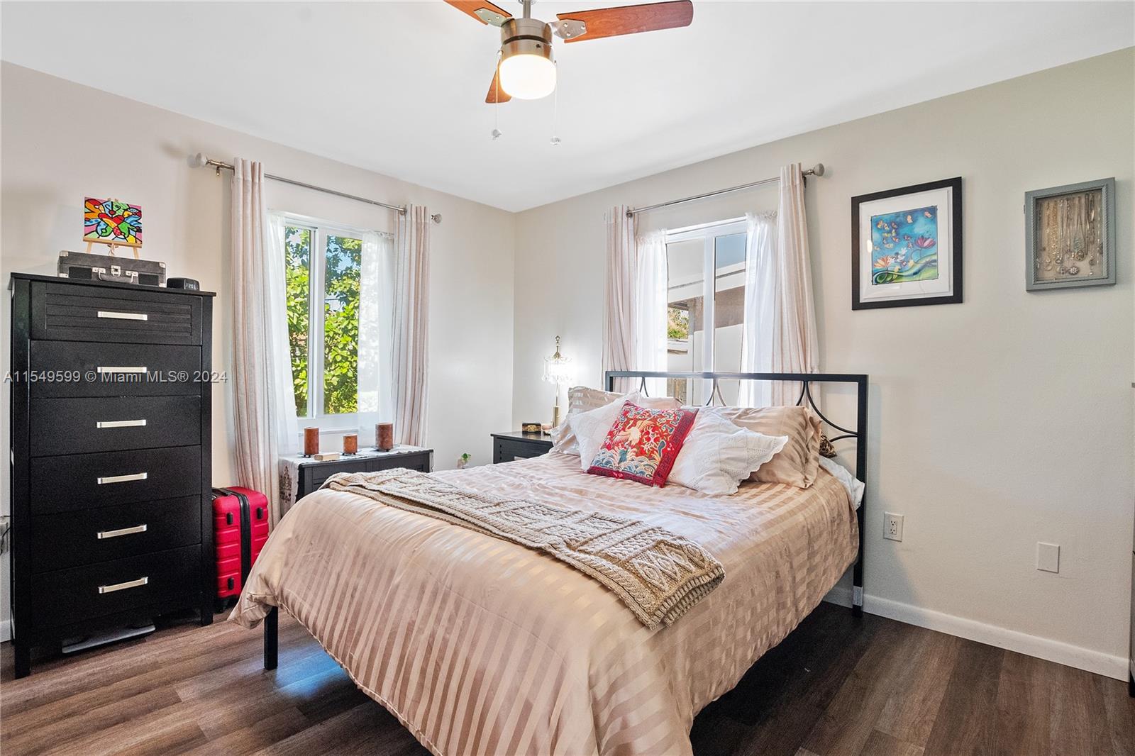 5819 Southwest 4th Street Miami, FL 33144 - Photo 21 of 27 a bedroom with a bed a dresser and a window