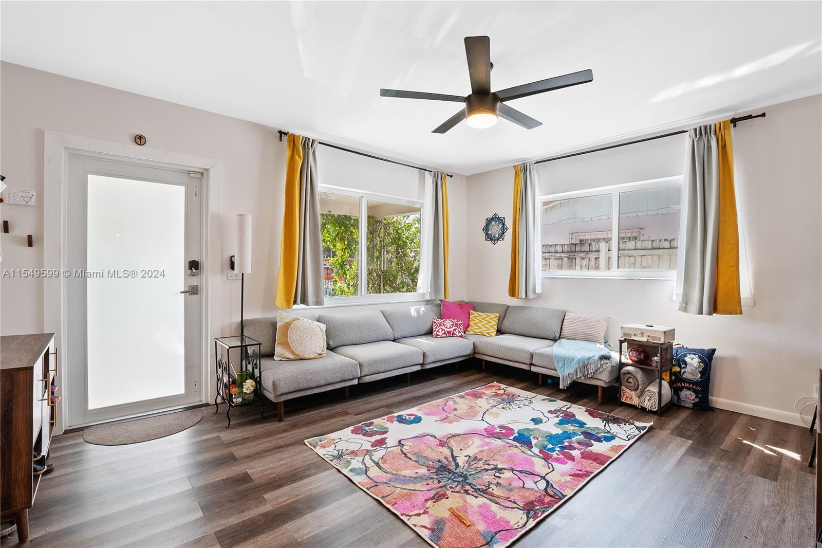 5819 Southwest 4th Street Miami, FL 33144 - Photo 5 of 27 a living room with furniture and a large window