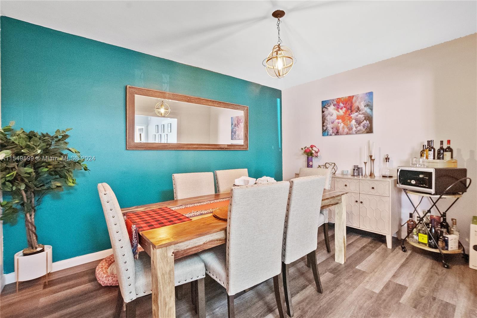 5819 Southwest 4th Street Miami, FL 33144 - Photo 9 of 27 a view of a dining room with furniture and wooden floor