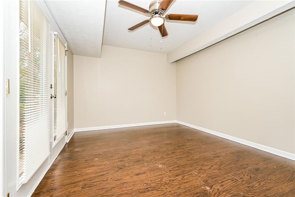 107 Parkview Drive Stockbridge, GA 30281 - Photo 14 of 25 a view of an empty room with wooden floor