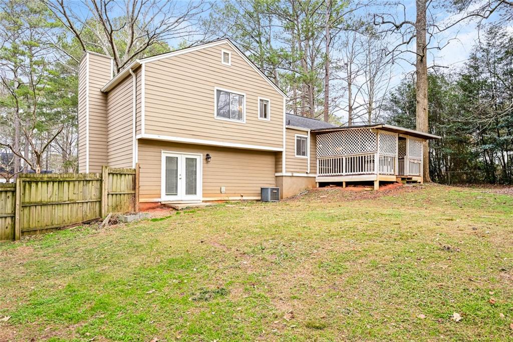 107 Parkview Drive Stockbridge, GA 30281 - Photo 6 of 25 a house with trees in front of it
