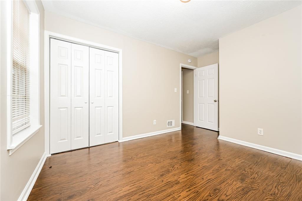 107 Parkview Drive Stockbridge, GA 30281 - Photo 9 of 25 a view of an empty room with wooden floor