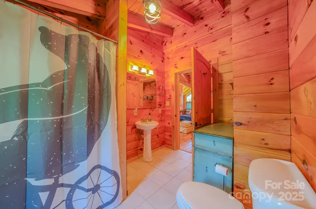 a view of balcony with a wooden floor and brick wall