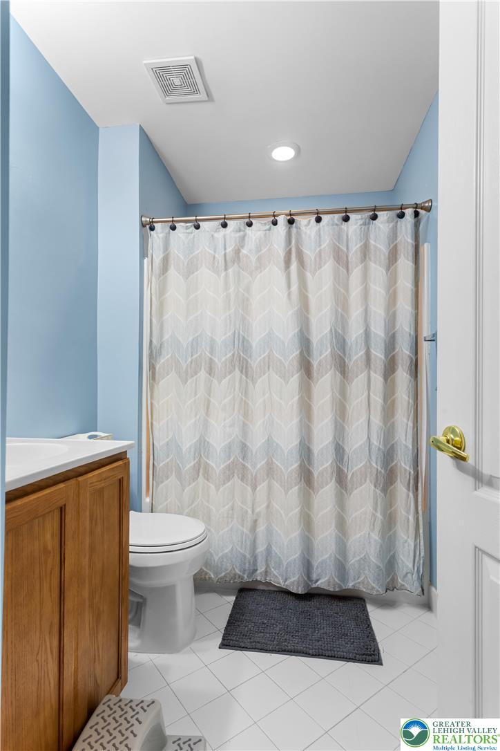 3420 Westminster Way Nazareth, PA 18064 - Photo 16 of 21 a bathroom with a shower curtain and a sink