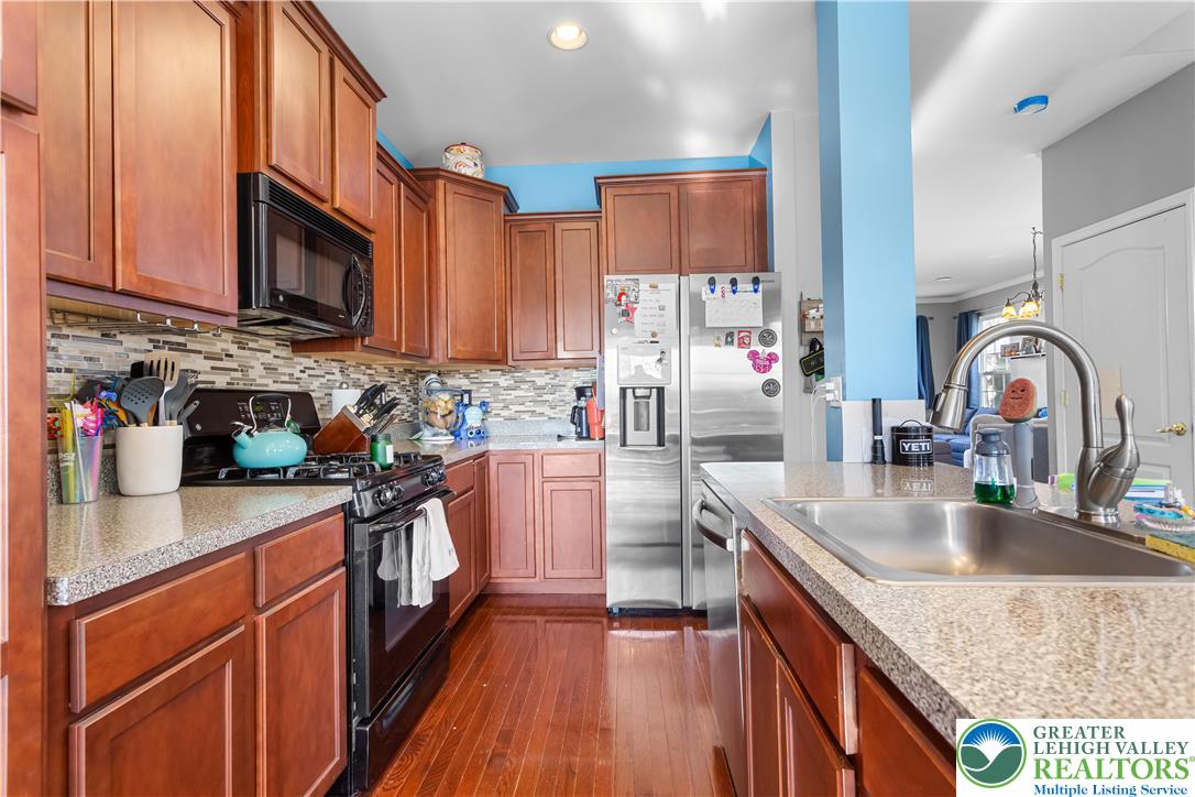 3420 Westminster Way Nazareth, PA 18064 - Photo 5 of 21 a kitchen with stainless steel appliances granite countertop a sink stove and refrigerator
