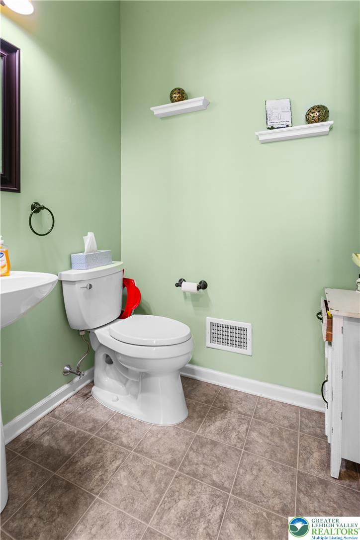 3420 Westminster Way Nazareth, PA 18064 - Photo 8 of 21 a white toilet sitting next to a bathroom sink and a shower