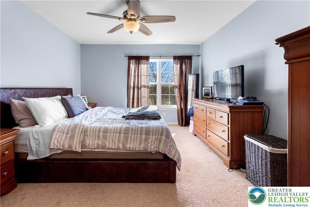 3420 Westminster Way Nazareth, PA 18064 - Photo 9 of 21 a bedroom with a bed and a flat screen tv
