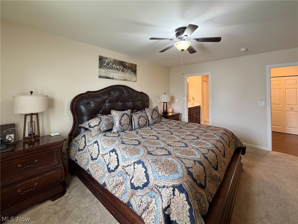 1343 Courtland Road Weirton, WV 26062 - Photo 20 of 50 Bedroom featuring light colored carpet, ceiling fan, and ensuite bathroom