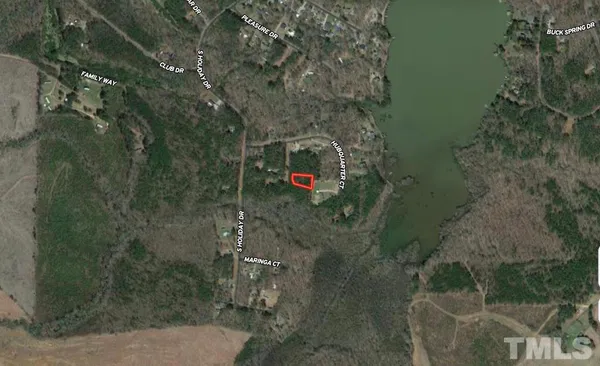 a aerial view of a house with a yard