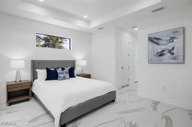 a spacious bathroom with a bathtub and sink