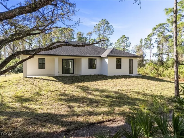 a backyard of a house with lots of green space