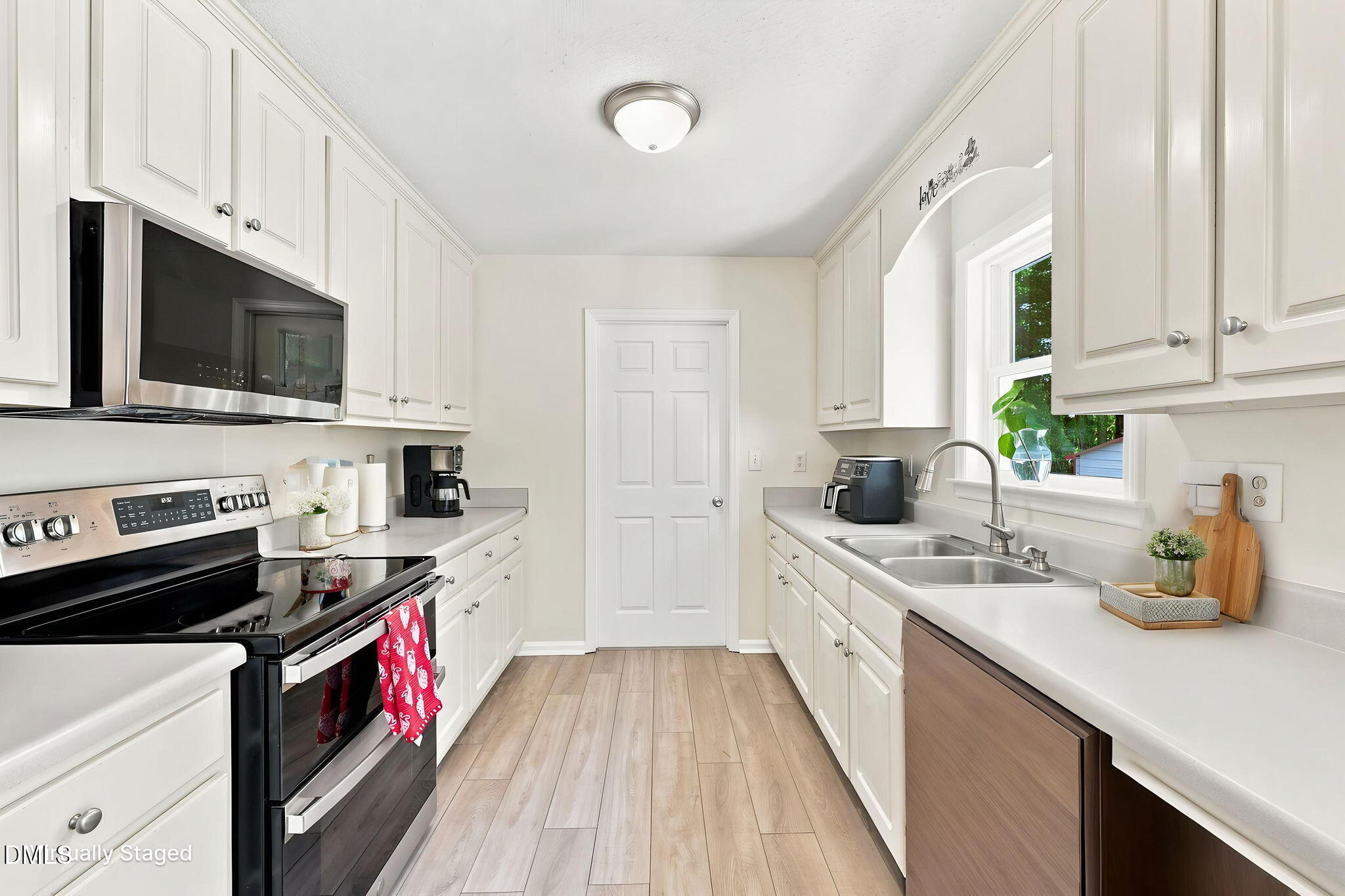 5419 Cleveland Road Clayton, NC 27520 - Photo 11 of 39 Bright galley kitchen with ample storage