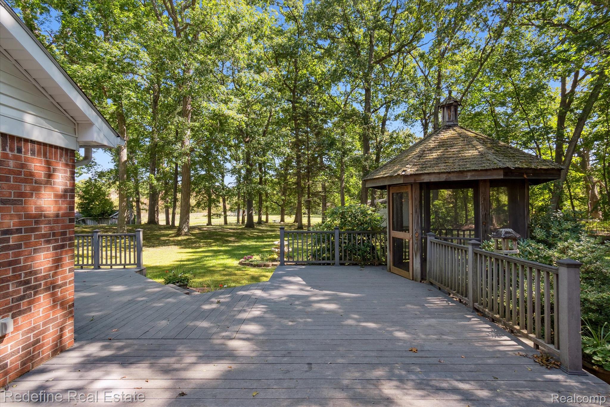 3777 Dorr Road Brighton, MI 48116 - Photo 50 of 77 Wooden terrace featuring a gazebo and a yard