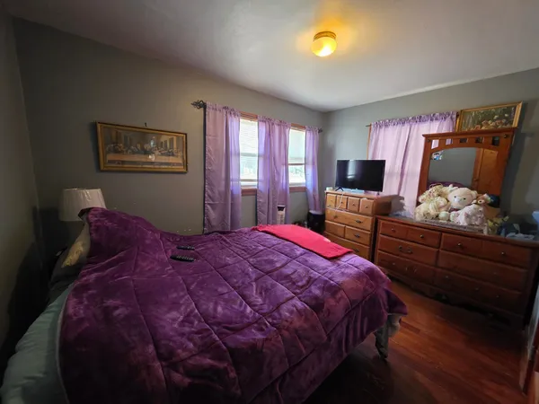 a bed room with a bed and a window