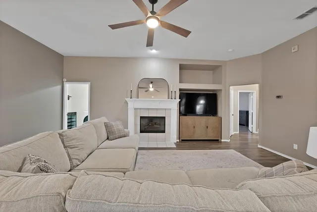 a living room with furniture and a fireplace