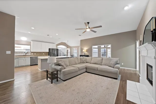 a living room with furniture and a fireplace