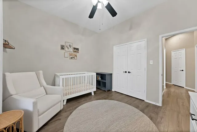 a bedroom with furniture and a window