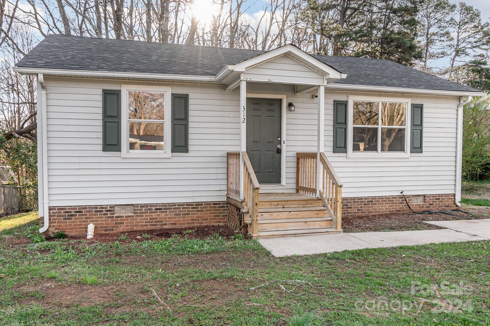 312 Moore Drive Lexington, NC 27292 - Photo 13 of 19 a front view of a house with a yard