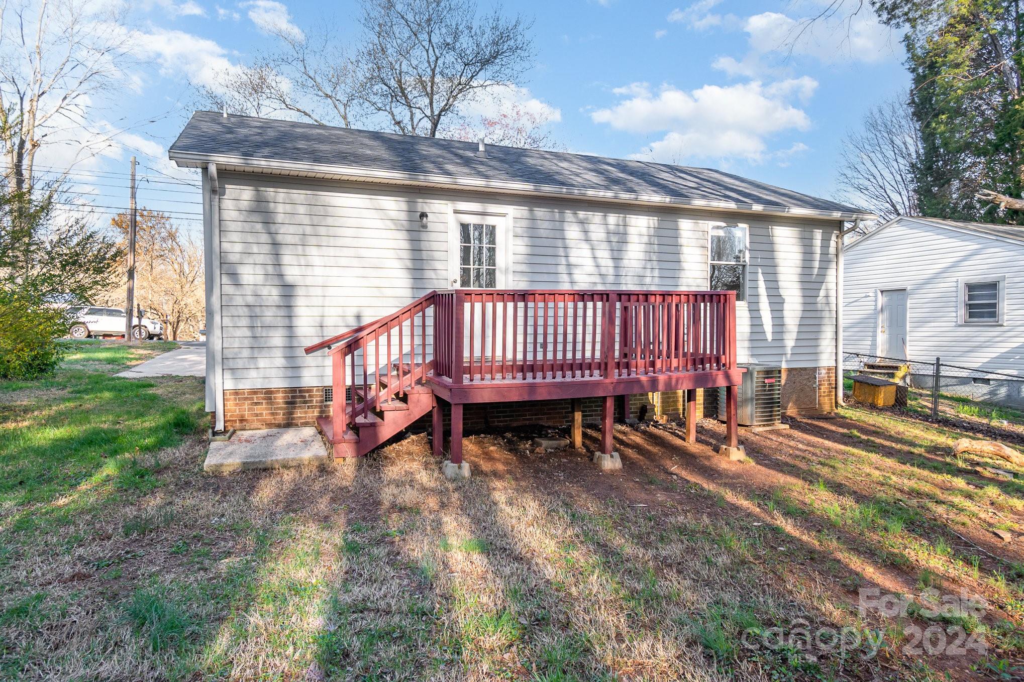 312 Moore Drive Lexington, NC 27292 - Photo 18 of 19 a view of a house with a bed and wooden floor