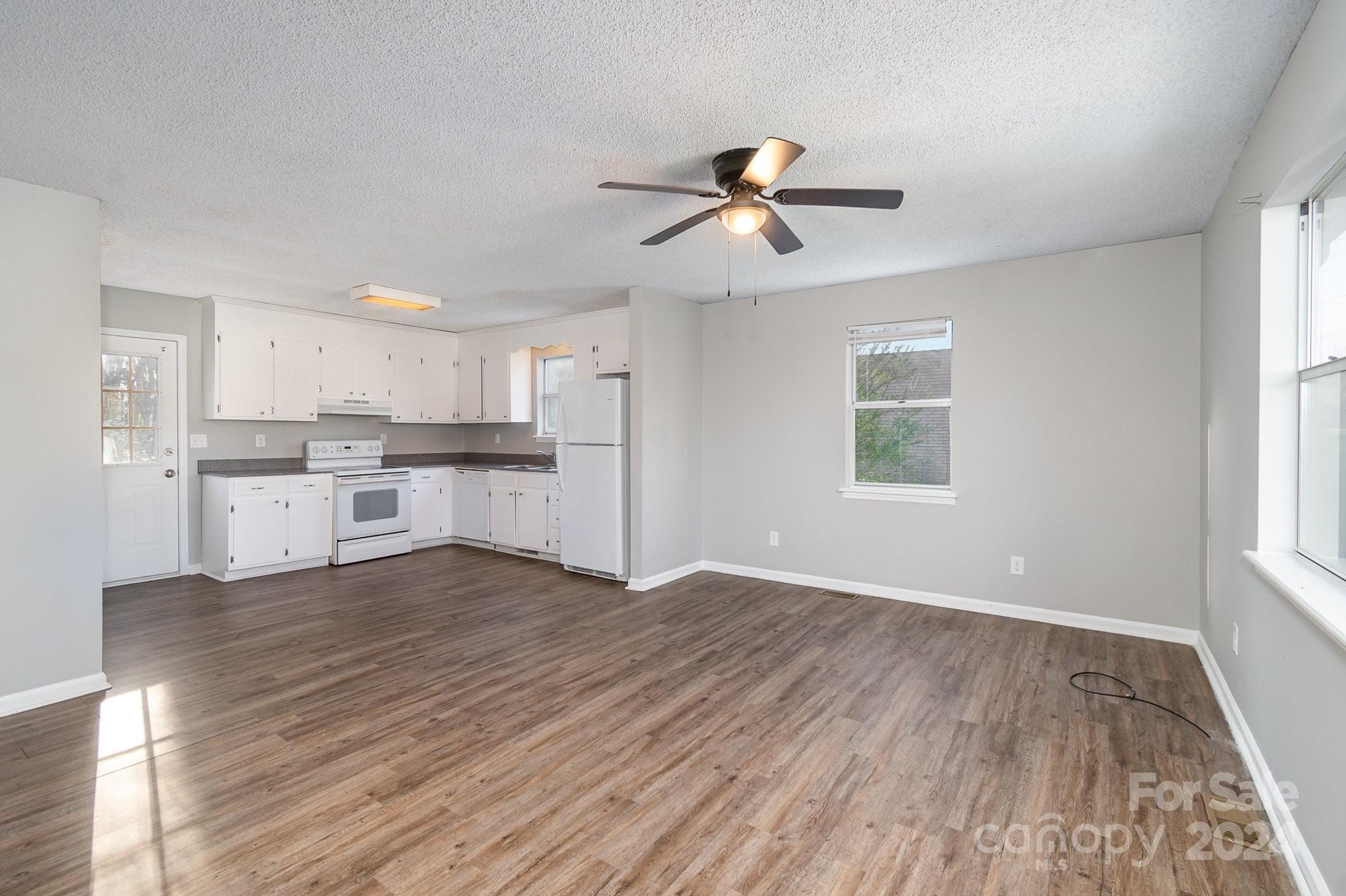312 Moore Drive Lexington, NC 27292 - Photo 2 of 19 a view of kitchen with wooden floor electronic appliances and window