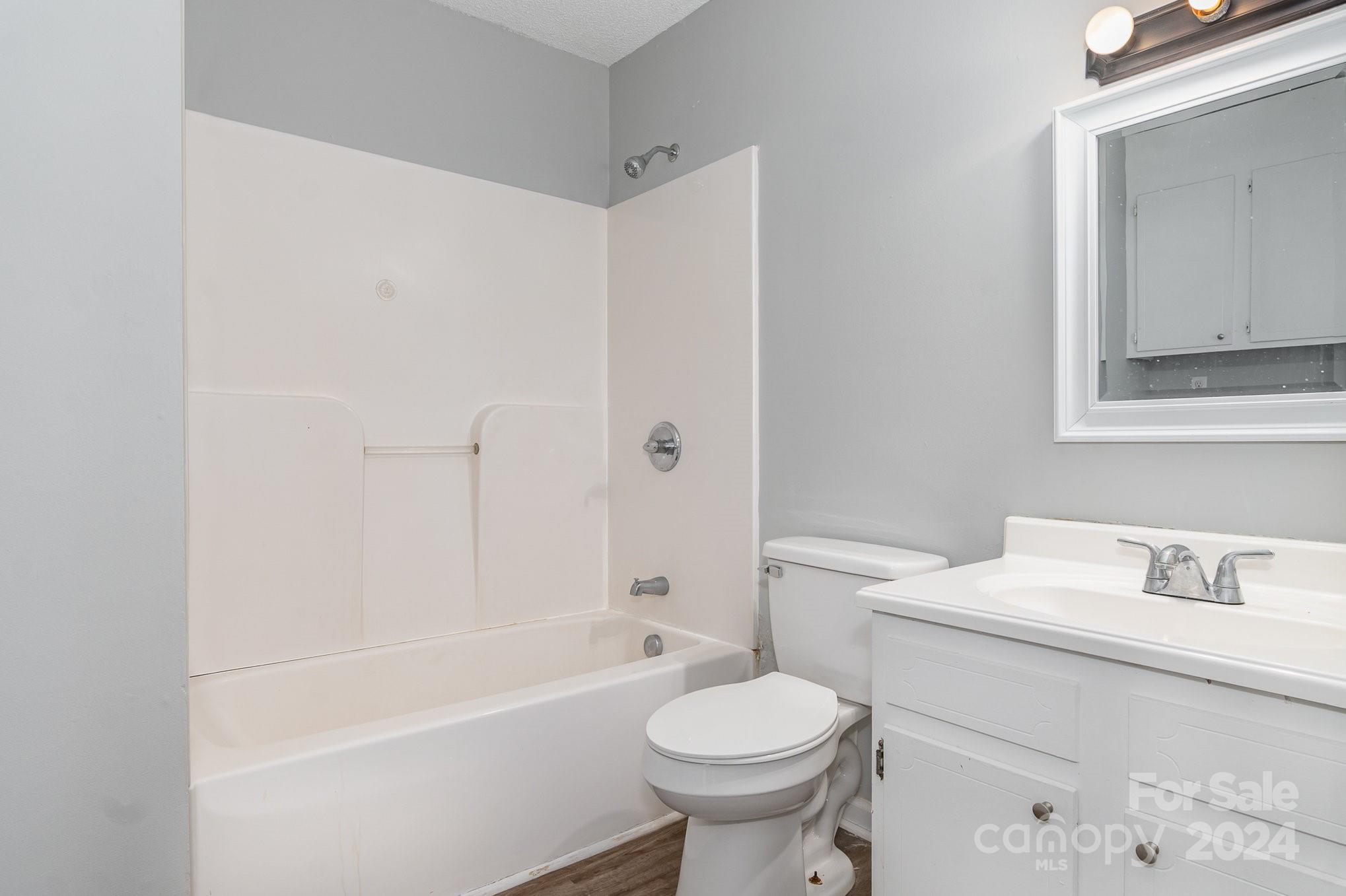 312 Moore Drive Lexington, NC 27292 - Photo 4 of 19 a bathroom with a sink toilet and shower