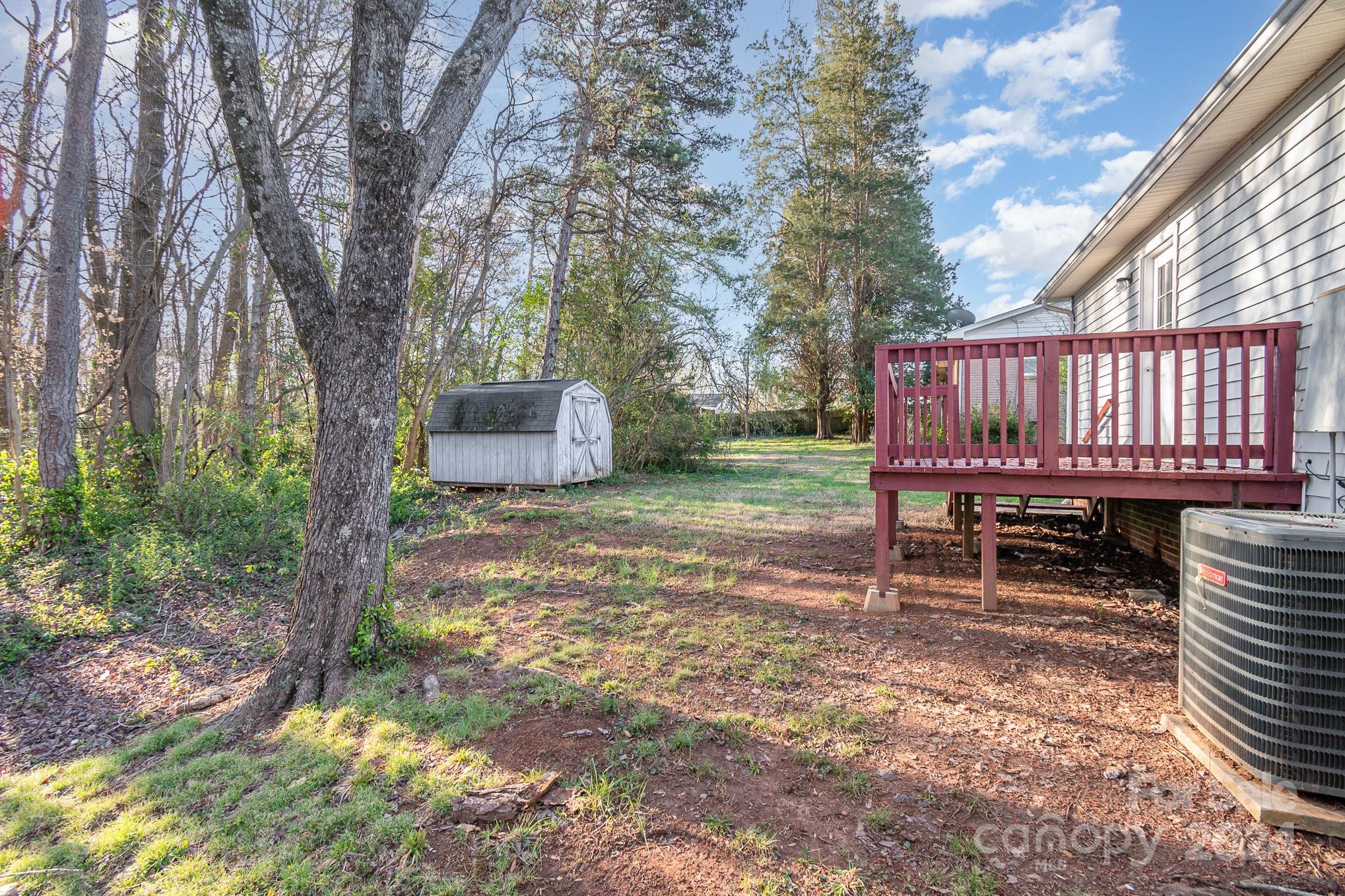 312 Moore Drive Lexington, NC 27292 - Photo 7 of 19 a backyard of a house with table and chairs