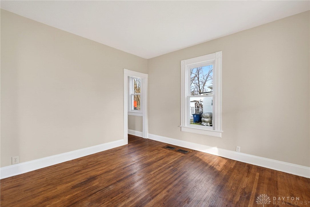 585 North Spring Street Wilmington, OH 45177 - Photo 3 of 21 This bright space features rich hardwood flooring and ample natural light through well-framed windows.