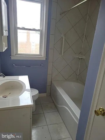 a bathroom with a bathtub and window