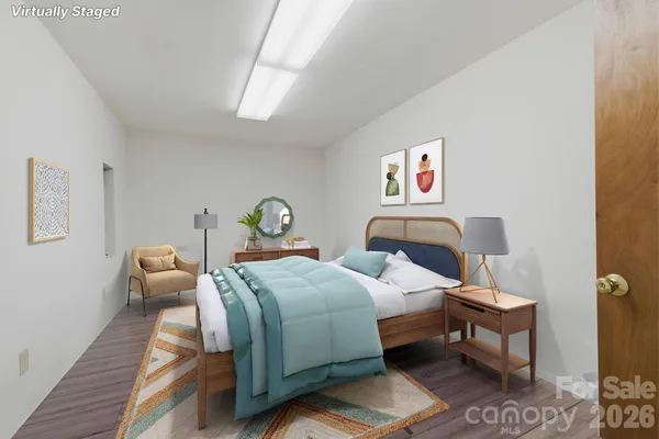 a spacious bathroom with a granite countertop sink and a mirror