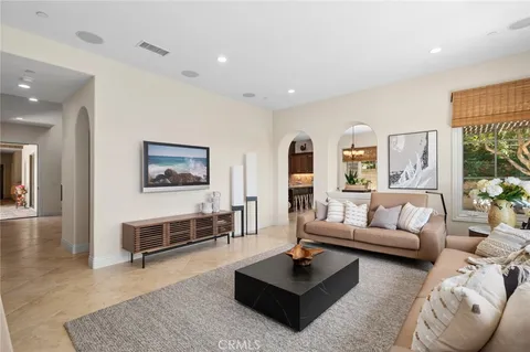 a living room with furniture and a rug