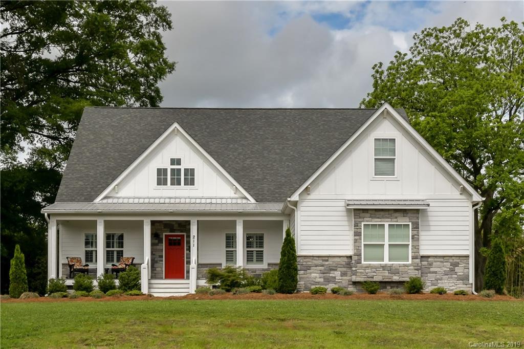 211 Scottish Highland Road Clover, SC 29710 - Photo 1 of 36 a front view of a house with a yard