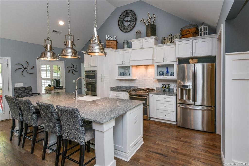 211 Scottish Highland Road Clover, SC 29710 - Photo 13 of 36 a kitchen with granite countertop a refrigerator a stove a sink and a refrigerator