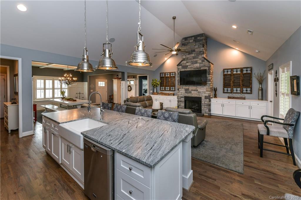 211 Scottish Highland Road Clover, SC 29710 - Photo 15 of 36 a large kitchen with lots of counter space and wooden floor