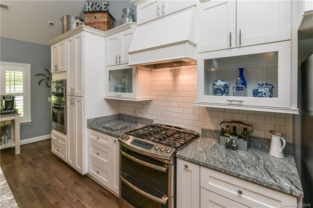 211 Scottish Highland Road Clover, SC 29710 - Photo 16 of 36 a kitchen with stainless steel appliances granite countertop a stove and a sink
