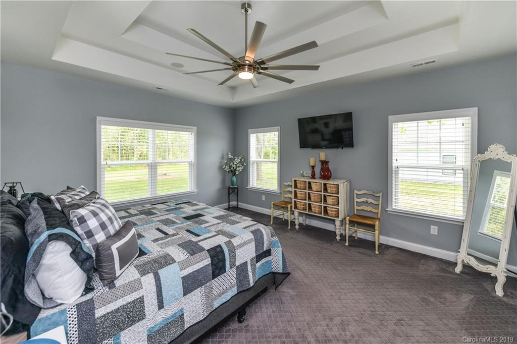 211 Scottish Highland Road Clover, SC 29710 - Photo 17 of 36 a bedroom with a bed and a window