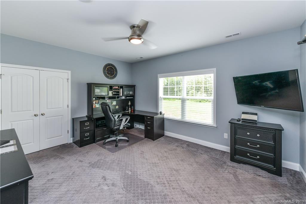 211 Scottish Highland Road Clover, SC 29710 - Photo 25 of 36 a view of workspace with flat screen tv and windows