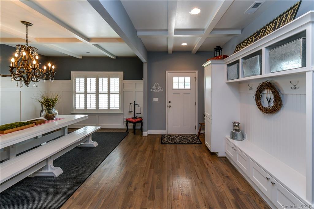 211 Scottish Highland Road Clover, SC 29710 - Photo 5 of 36 a room with lots of wooden furniture and windows