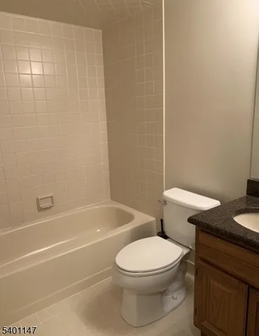 a bathroom with a toilet a sink and bathtub