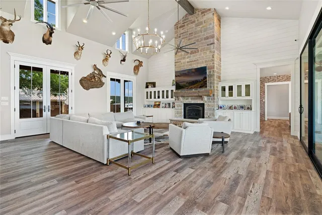 a living room with fireplace furniture and a flat screen tv