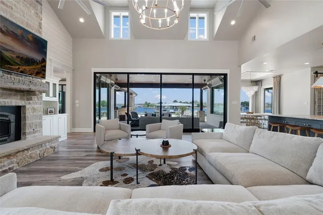 a living room with fireplace furniture and a flat screen tv