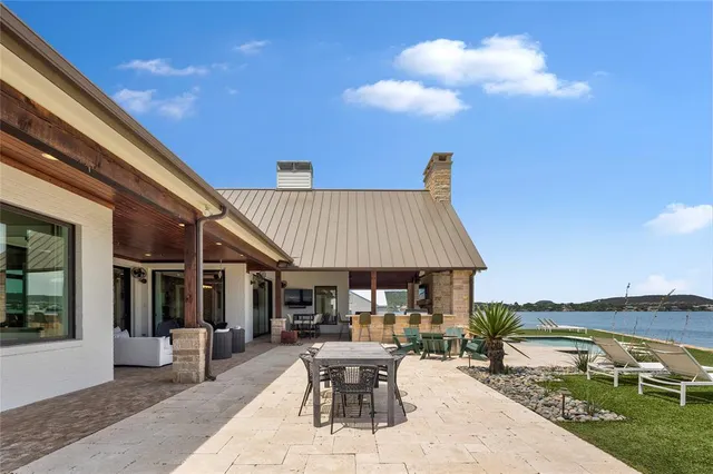 a view of a patio with chairs and tables