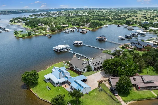 an aerial view of lake residential house with outdoor space