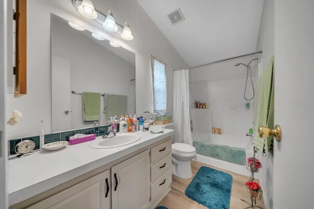 a bathroom with a sink double vanity and a mirror