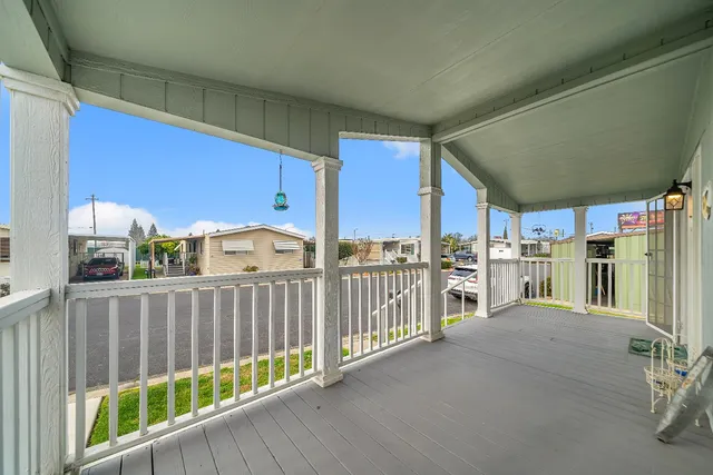 a view of a porch with wooden fence