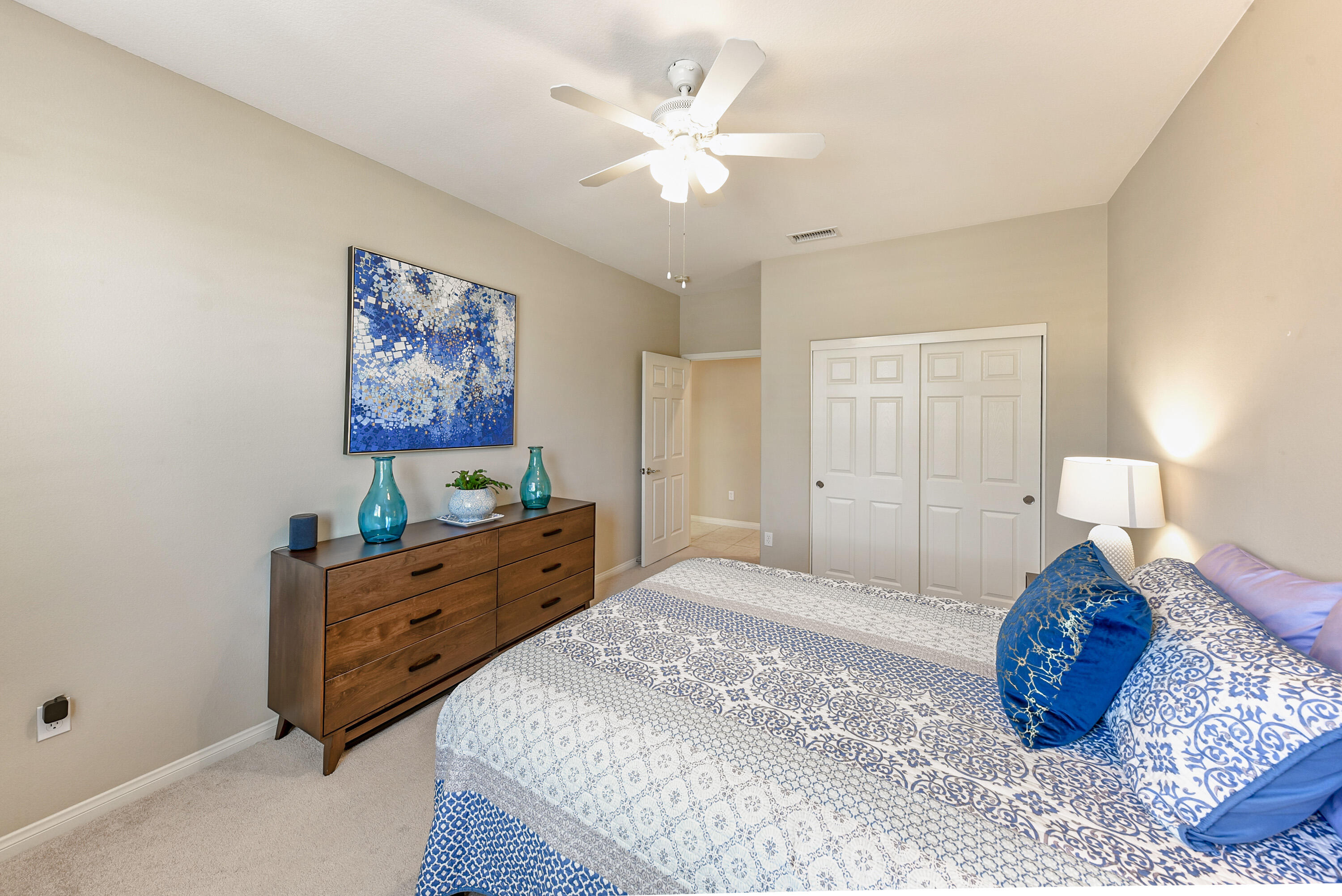 81190 Corte Del Olma Indio, CA 92203 - Photo 16 of 47 a spacious bedroom with a bed and a chandelier