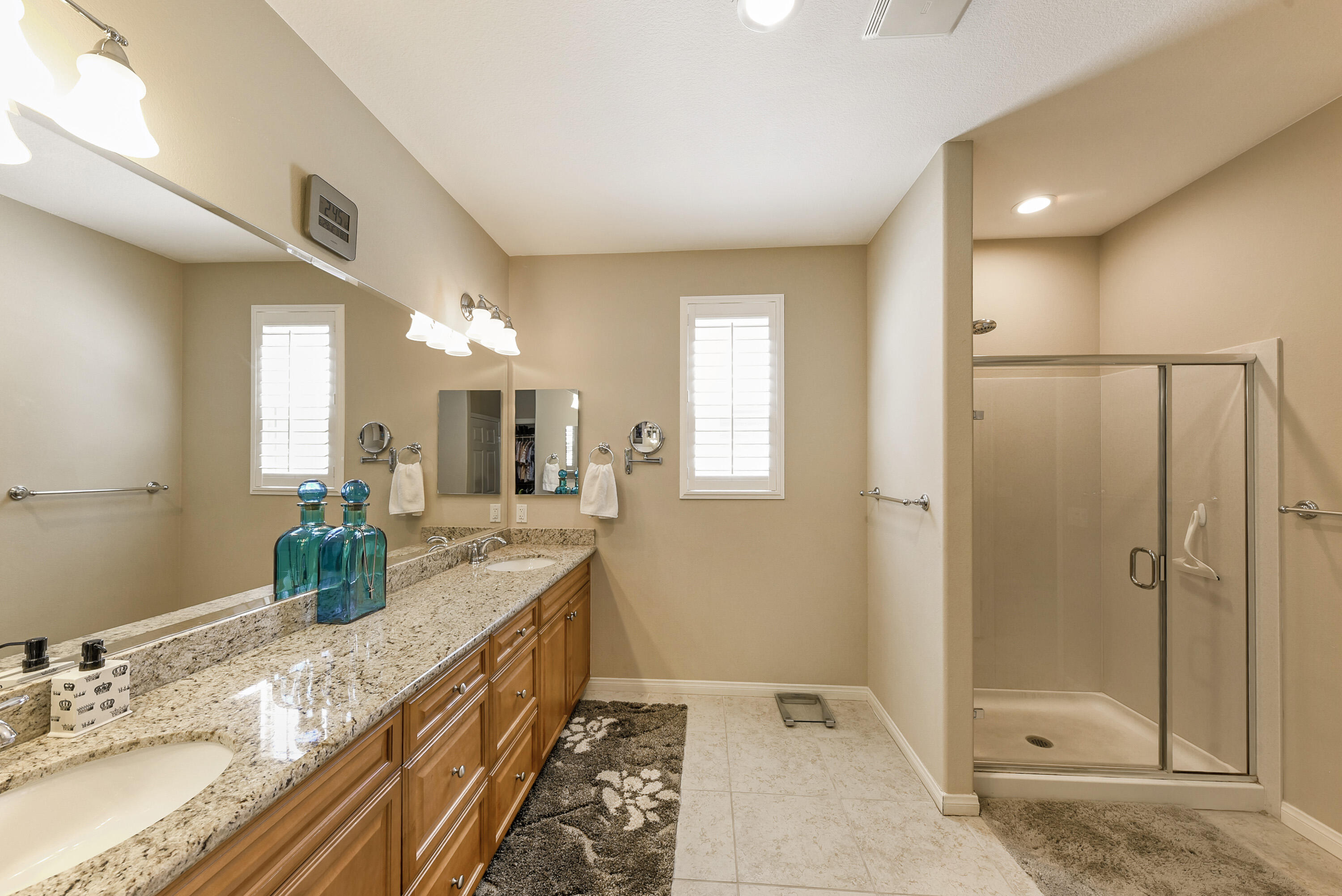 81190 Corte Del Olma Indio, CA 92203 - Photo 23 of 47 a bathroom with double vanity and a shower