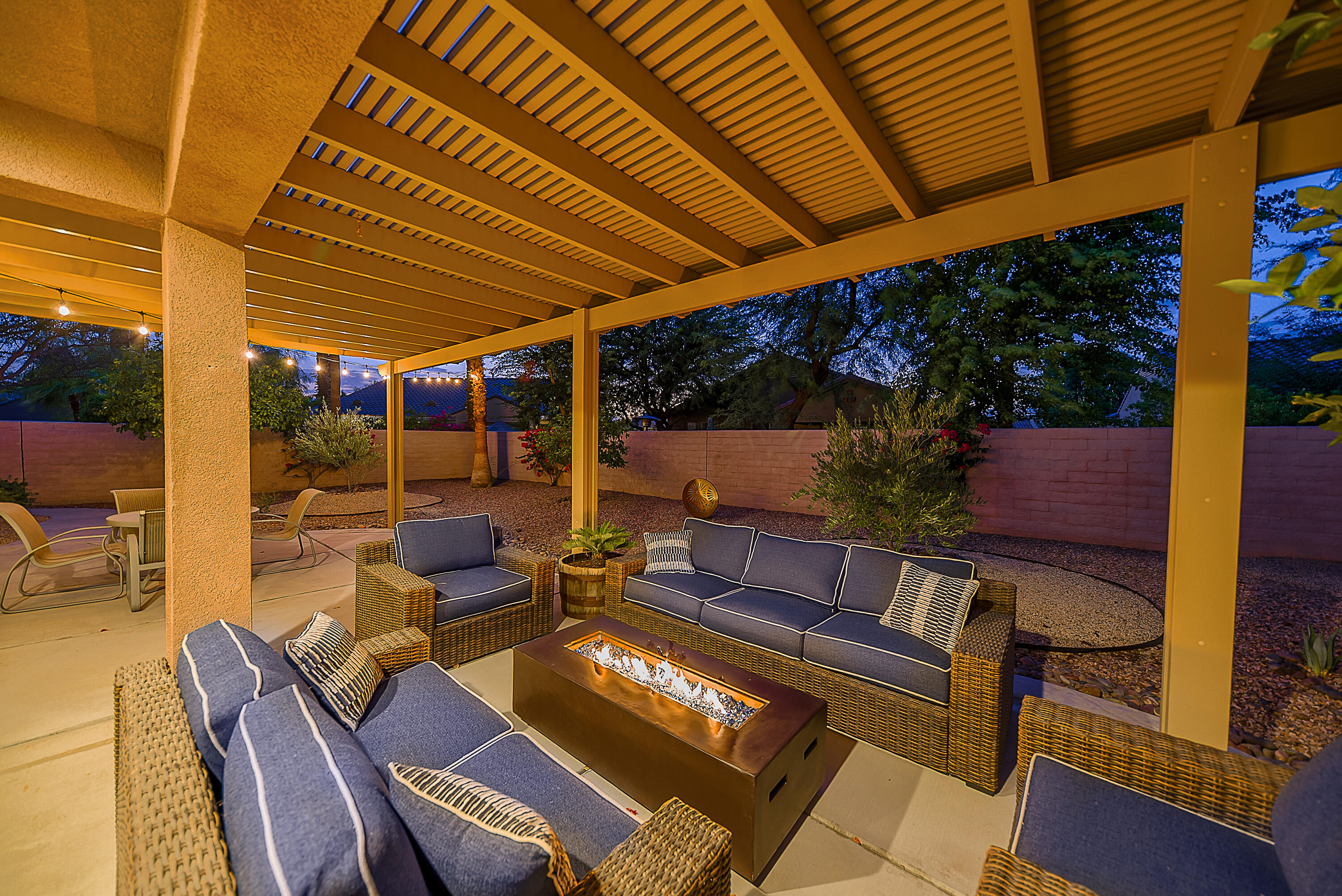 81190 Corte Del Olma Indio, CA 92203 - Photo 33 of 47 a view of a patio with table and chairs potted plants with wooden floor