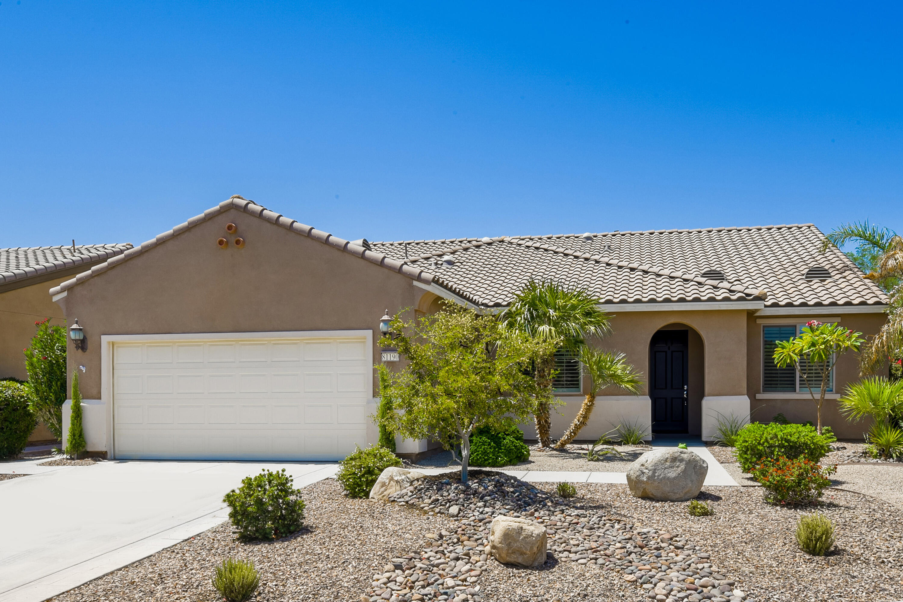 81190 Corte Del Olma Indio, CA 92203 - Photo 34 of 47 a front view of a house with garden