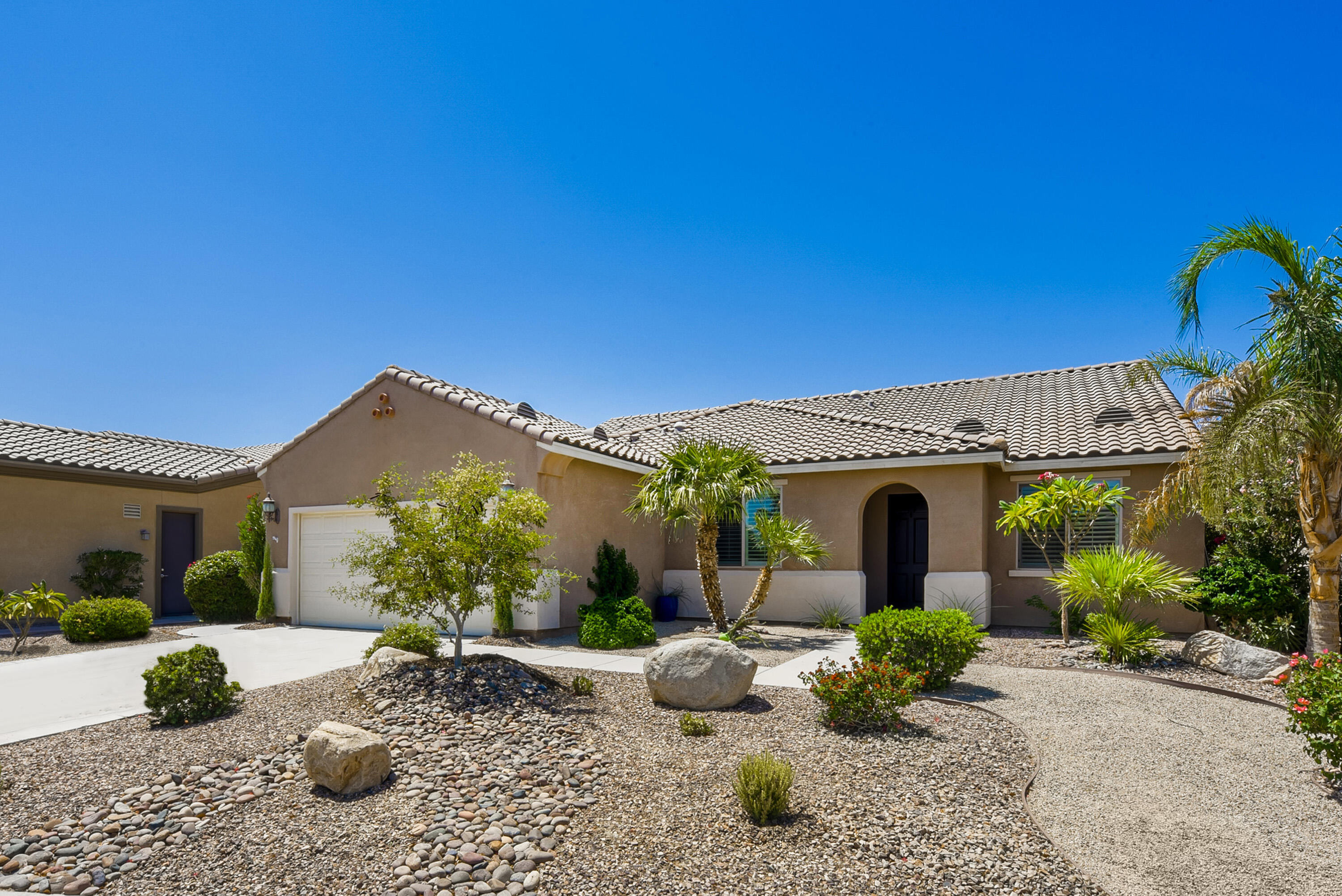 81190 Corte Del Olma Indio, CA 92203 - Photo 4 of 47 a front view of a house with garden