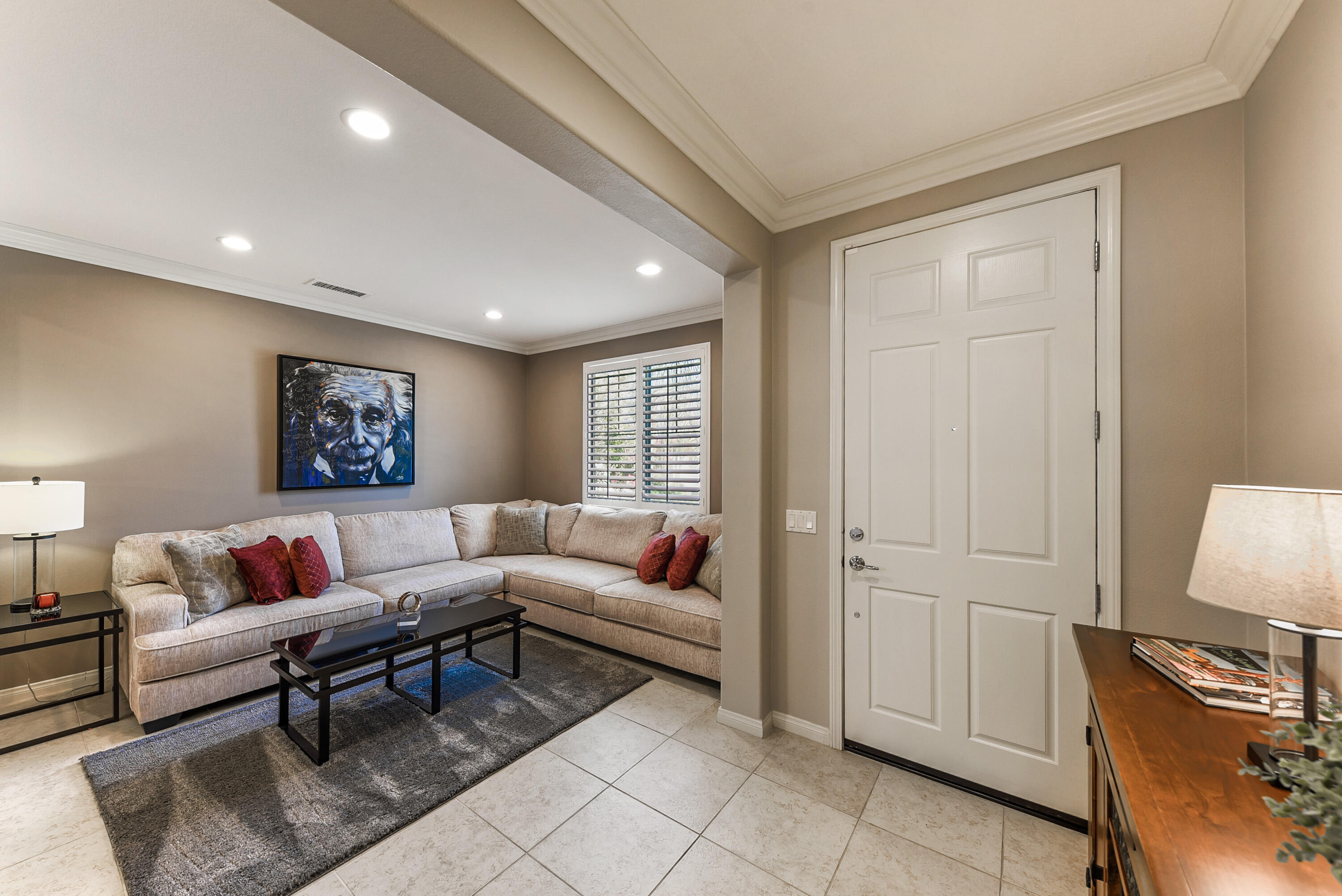 81190 Corte Del Olma Indio, CA 92203 - Photo 5 of 47 a living room with furniture a lamp and a window